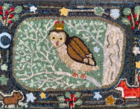 Image of a hooked rug with an owl on it.